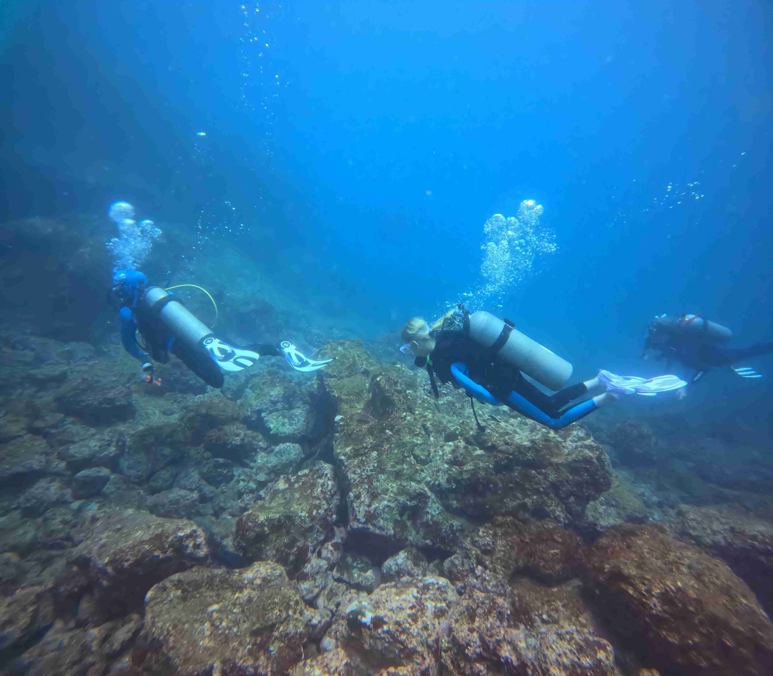 Divers practicing Peak Performance Buoyancy scuba diving Guanacaste in the clear waters of the Pacific Ocean of Costa Rica