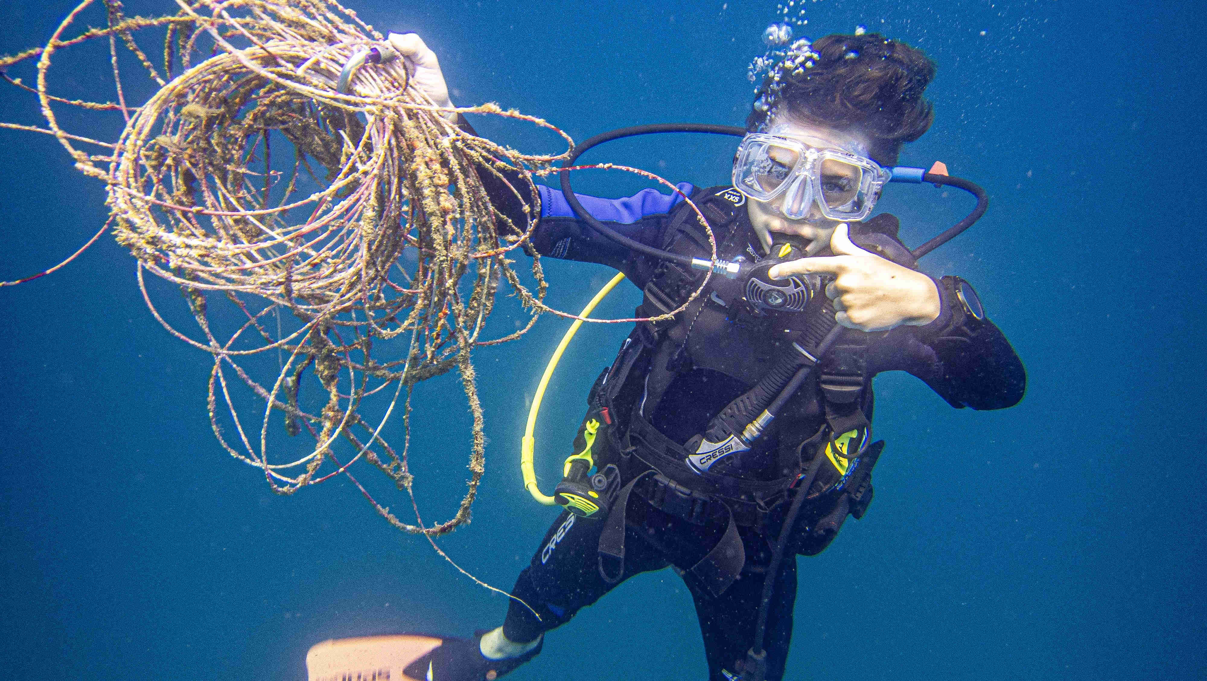 Dive Against Debris course participant cleaning the ocean while scuba diving Costa Rica - Under the Sea Diving the Best Scuba Diving in Costa Rica