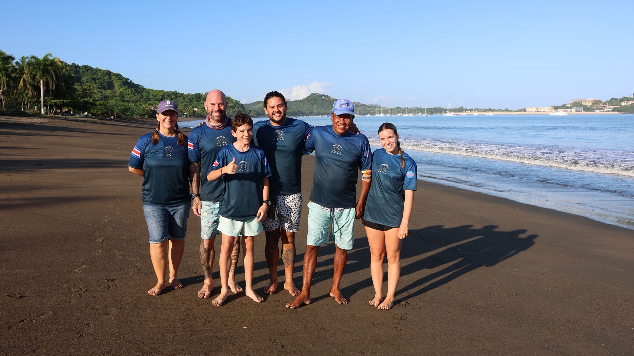 The Under The Sea Diving Team in front of the Pacific Ocean in Costa Rica