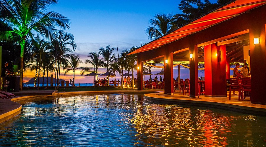 Hemmingways Restaurant in Playa Potrero, Guanacaste, Costa Rica, sky changing colors for Sunset
